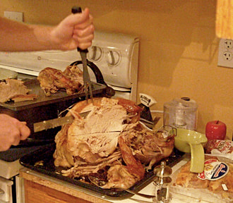 A roast turkey being carved