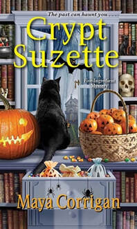Cover of Crypt Suzette by Maya Corrigan with a black cat, jack o'lantern, candy corn, and shelves with books and Halloween decorations